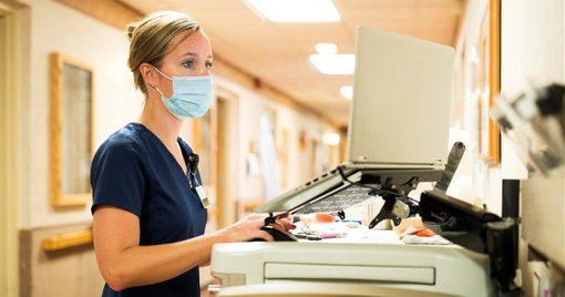 Medical professional in front of a hospital computer
