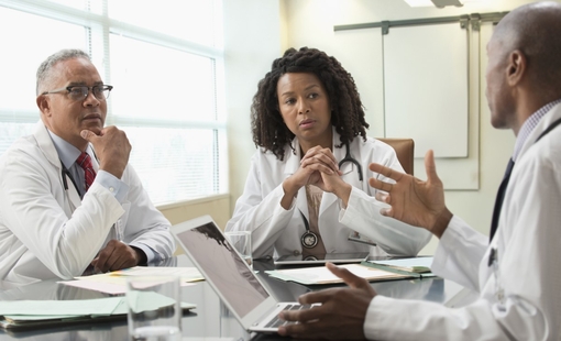 Doctors talking in office meeting