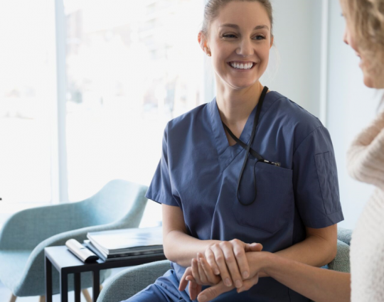 Nurse speaking with a patient