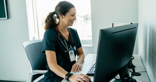 Healthcare provider sitting in front of computer 